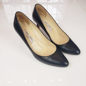 Jimmy Choo black pumps.